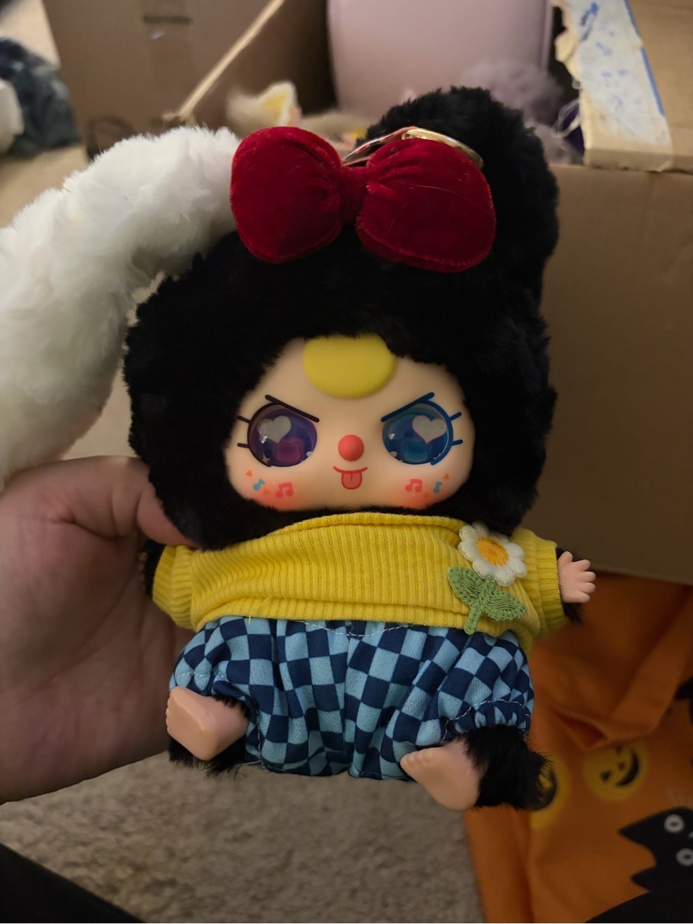 Plush Character Toy in Black and Yellow with Red Bow